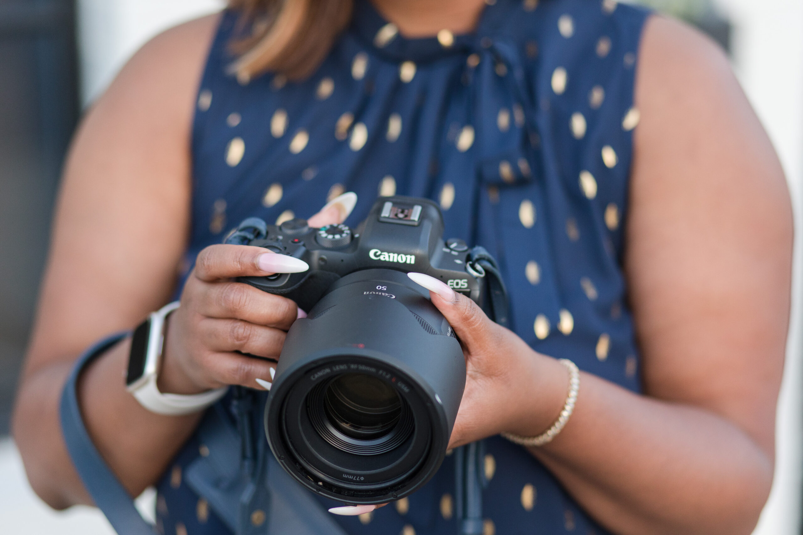 photo of women holden camera